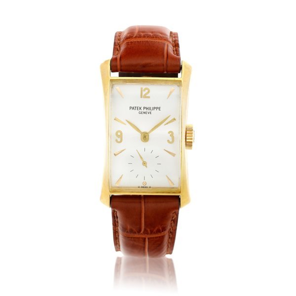 Patek Philippe Reference 2468 | A yellow gold rectangular wristwatch with faceted crystal, Circa 1955 · 2468